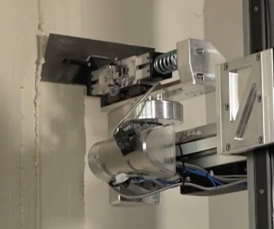 The two-axis rotary end effector as built, mounted on the machine