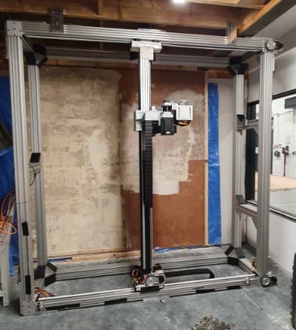 The 5-axis machine set up against a real test wall